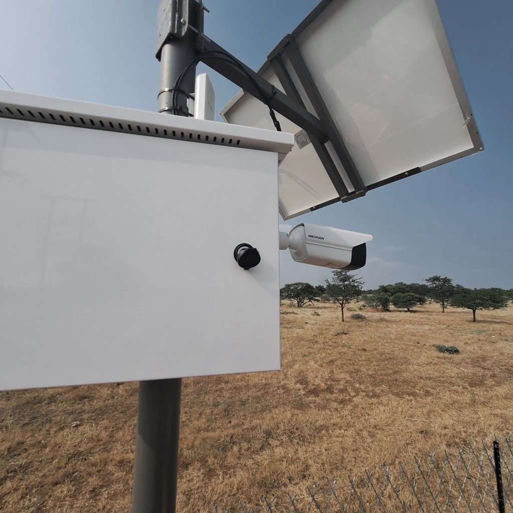 Solar-powered CCTV enclosure on a pole