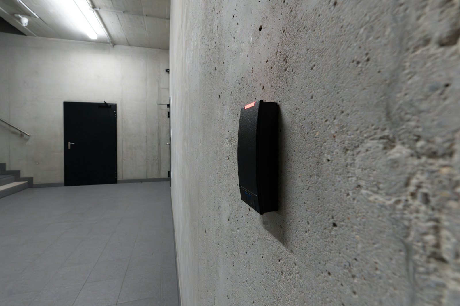 Access control card reader beside a door