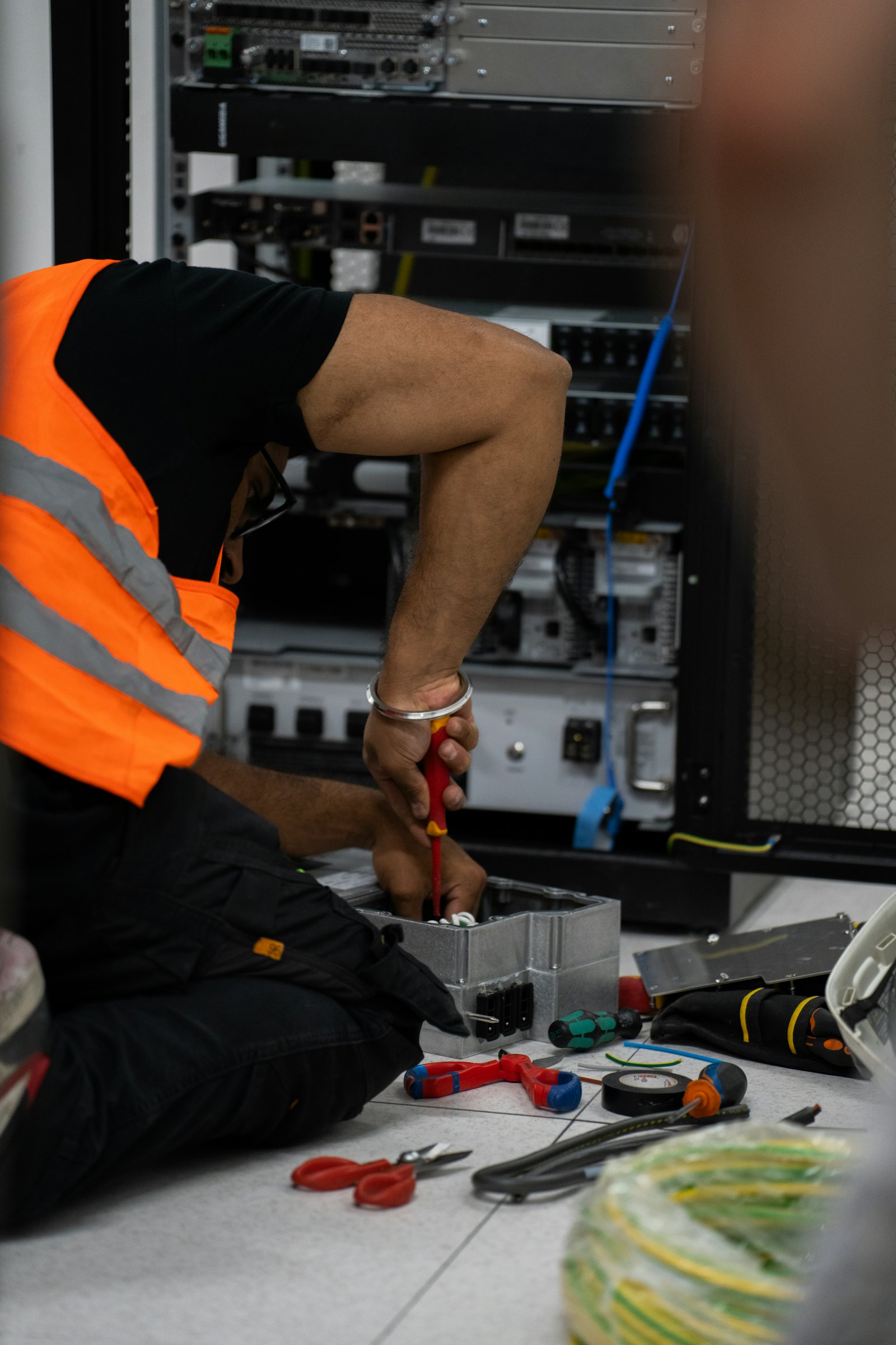 Technician terminating network cables